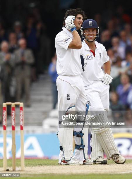 England's Alastair Cook celebrates his century with Jonathan Trott during the third npower Test at The Brit Insurance Oval, London.