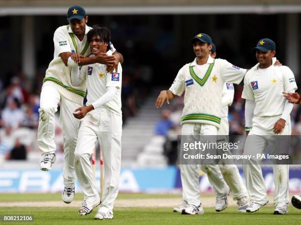 Pakistan's Mohammad Aamer celebrates with Wahab Riaz after bowling England's Matt Prior who was caught by Kamran Akmal during the third npower Test...