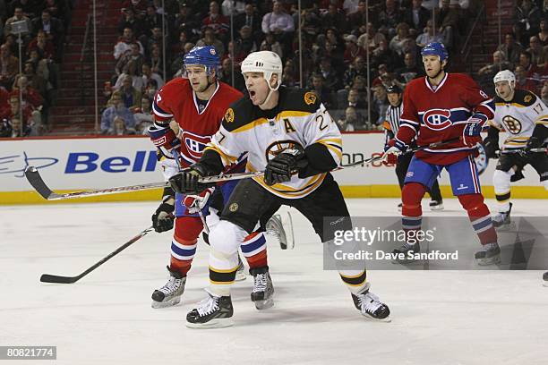 Glen Murray of the Boston Bruins battles against Guillaume Latendresse of the Montreal Canadiens during game one of the Eastern Conference...