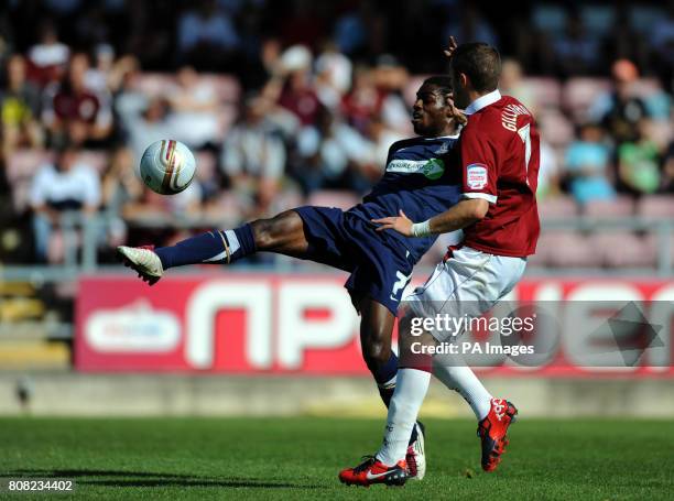 Northampton Town's Ryan Gilligan and Southend United's Anthony Grant battle for the ball during the npower League Two match at Sixfields Stadium,...