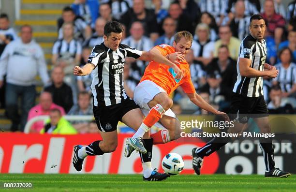 Newcastle United's Joey Barton and Blackpool's Luke Varney battle for the ball
