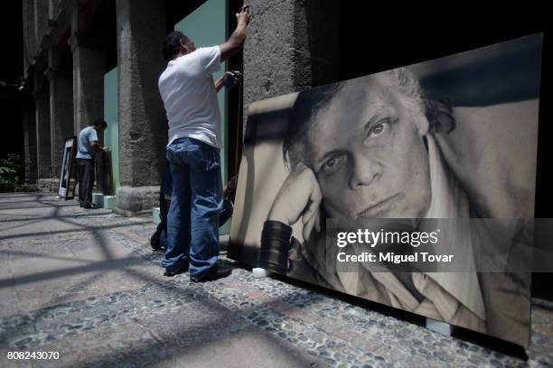 Workers install portraits of Jose Luis Cuevas before an homage to Mexican artist at Jose Luis Cuevas Museum on July 04, 2017 in Mexico City, Mexico....