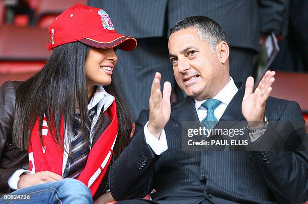 S Chief Executive Samir Al-Ansari and an unidentified woman sit in the directors box before Liverpool took on Chelsea in their UEFA Champions League...