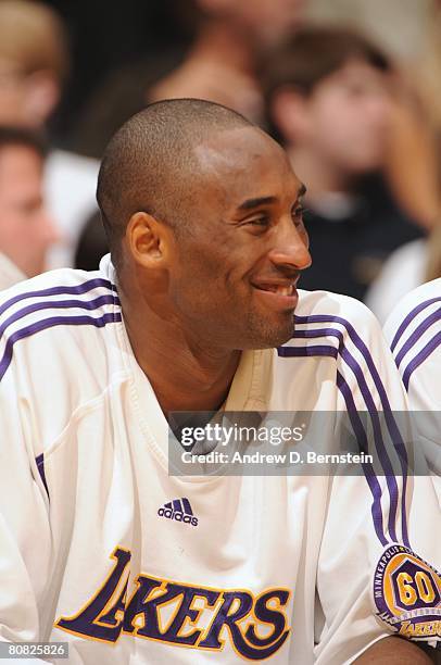 Kobe Bryant of the Los Angeles Lakers looks on with a smile as he takes a rest on the bench in Game One of the Western Conference Quarterfinals...