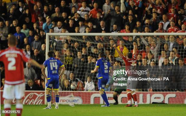 Leeds United's Neill Collins scores an own goal during the npower Championship match at Oakwell, Barnsley.