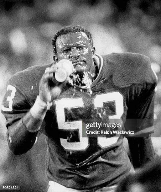 New York Giants linebacker Harry Carson , elected to the Class of 2006 Pro Football Hall of Fame, gives himself a Gatorade shower during a 19-23 loss...