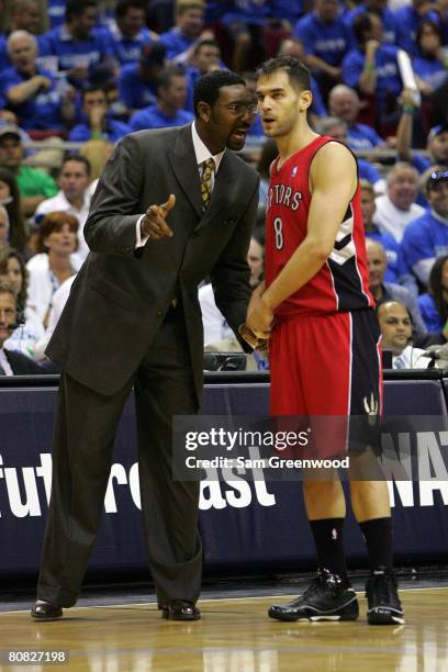 Head coach Sam Mitchell of the Toronto Raptors talks with Jose Calderon in Game Two of the Eastern Conference Quarterfinals during the 2008 NBA...