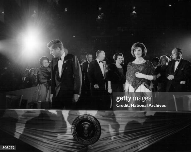 The President and Mrs. Kennedy attend a ceremony January 18, 1963.