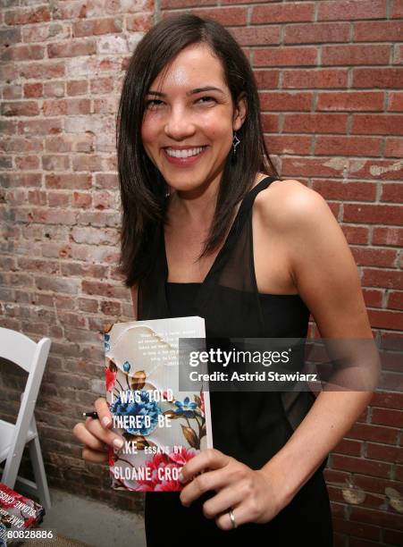 Sloane Crosley poses with her book " I Was Told There'd Be Cake" at Helmet Lang on April 22, 2008 in New York City.