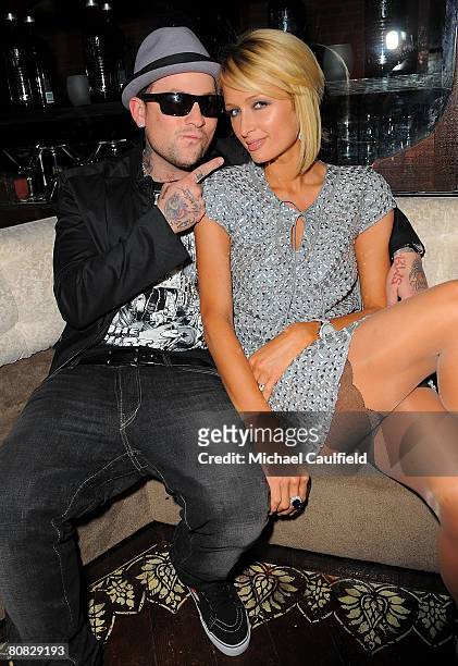 Musician Benji Madden and Paris Hilton pose during the "Glow in the Dark Tour 2008" party ignited by Absolute 100 held at GOA on April 22, 2008 in...