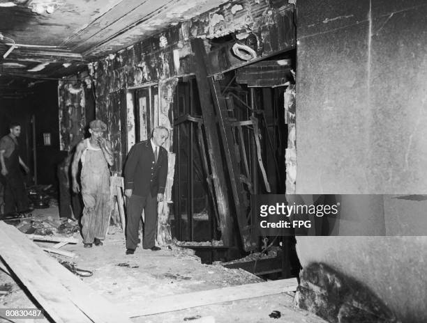 Exposed lift shafts on a damaged floor of the Empire State Building, after a B-25 Mitchell bomber crashed into the north side of the skyscraper, New...