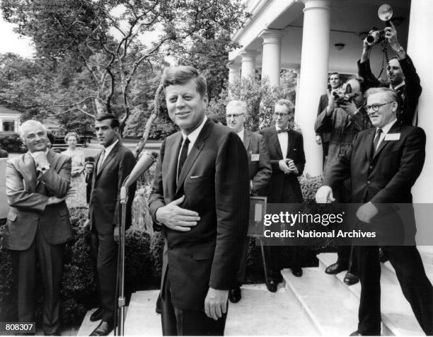 President John F. Kennedy laughs with reporters after a White House press conference May 9, 1963.