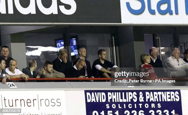 Liverpool's Christian Poulsen, Pepe Reina, Paul Konchesky and Joe Cole watch from the stands during the third round Carling Cup match at Anfield,...