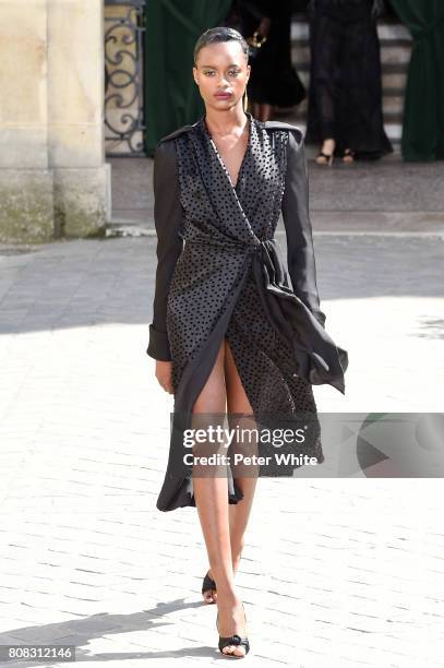 Mayowa Nicholas walks the runway during the Ulyana Sergeenko Haute Couture Fall/Winter 2017-2018 show as part of Haute Couture Paris Fashion Week on...