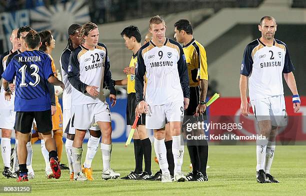 Daniel Allsopp of melbourne Victory leaves the ground with his team mates after the AFC Champions League Group G match between Gamba Osaka and...