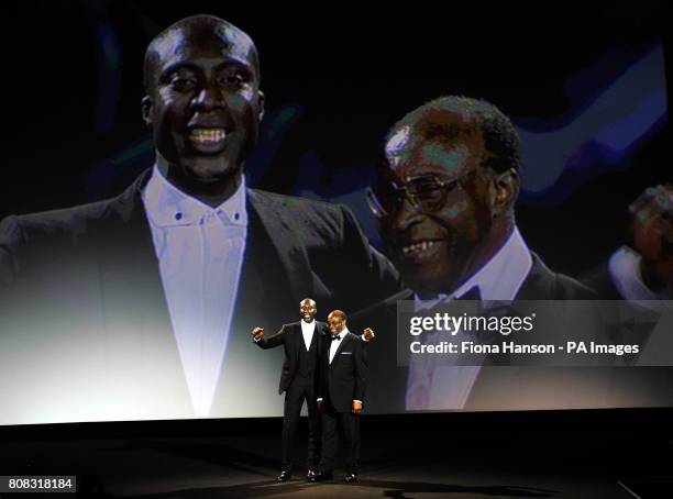 Designer Ozwald Boateng with his father Kwesi on stage after his A Man's Story Collection, part of London Fashion Week held at the Odeon Leicester...