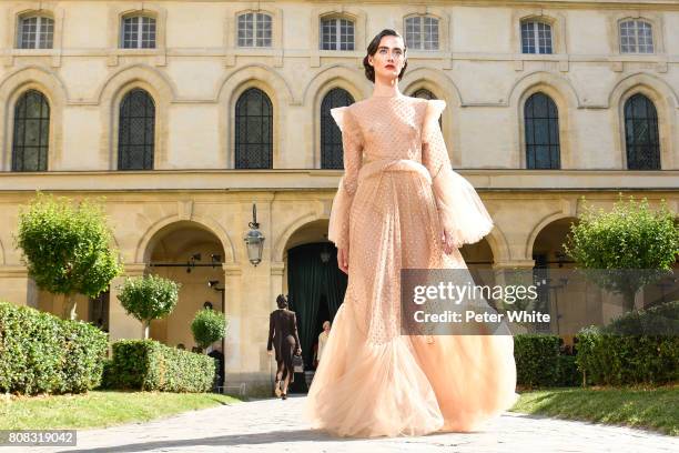 Amanda Googe walks the runway during the Ulyana Sergeenko Haute Couture Fall/Winter 2017-2018 show as part of Haute Couture Paris Fashion Week on...