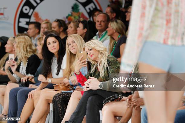 Mariella Ahrens, Jenny Elvers and Jennifer Knaeble attend the runway at the Riani Fashion Show Spring/Summer 2018 at Umspannwerk Kreuzberg on July 4,...