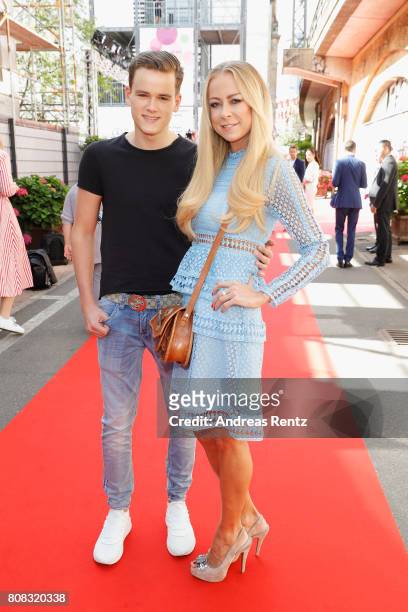 Actress Jenny Elvers and her son Paul attend the Riani Fashion Show Spring/Summer 2018 at Umspannwerk Kreuzberg on July 4, 2017 in Berlin, Germany.