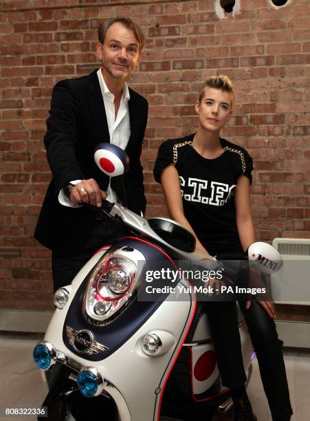 Model Agyness Deyn and Adrian van Hooydonk, Senior Vice President BMW Group Design at the global premiere of the new Mini Scooter E Concept at The...