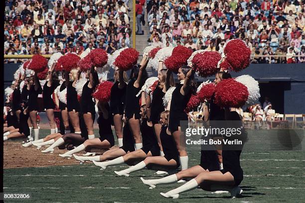 The Atlanta Falcons cheerleaders cheer on the the field during an NFL game against the Detroit Lions at Fulton-County Stadium on October 8, 1972 in...