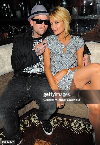 Musician Benji Madden and Paris Hilton pose during the "Glow in the Dark Tour 2008" party ignited by Absolute 100 held at GOA on April 22, 2008 in...