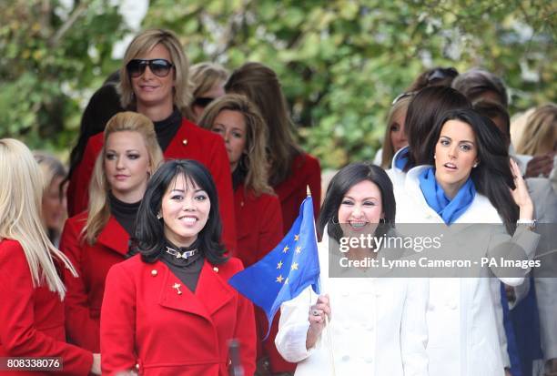 Lisa Pavin , wife of Corey Pavin, and Gaynor Montgomerie , wife of Colin Montgomerie, lead out the golfers' partners during the Opening Ceremony