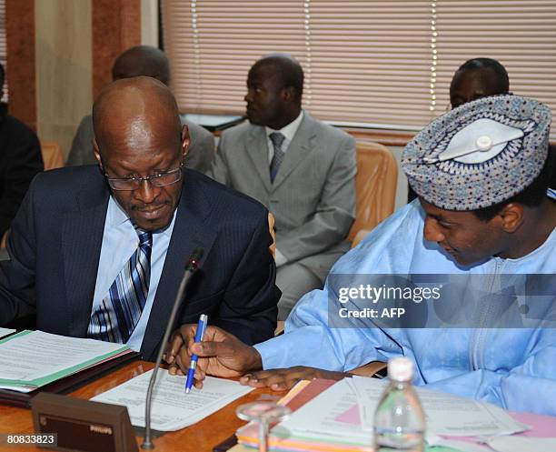 Nigerian Economics and Finance minister Ali Mahaman Lamine and his Malian counterpart Abou-Bakar Traore are pictured in Abidjan during a finance...
