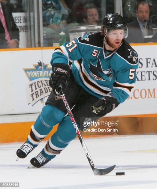 Brian Campbell of the San Jose Sharks skates on the ice with the puck during game five of the 2008 NHL Stanley Cup Playoffs conference quarter-final...