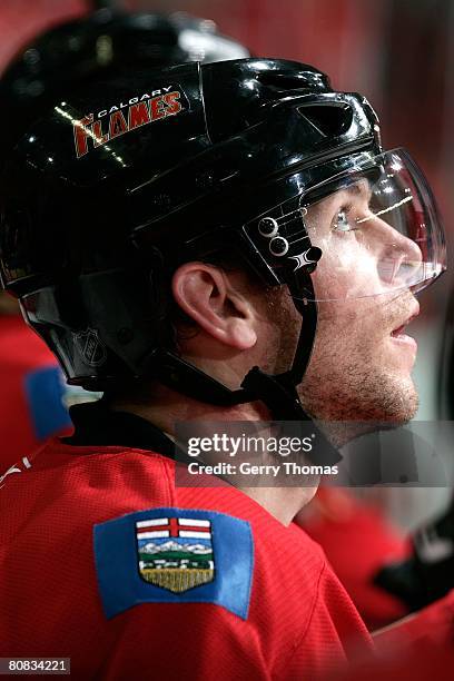 Alex Tanguay of the Calgary Flames watches the game from the bench in between shifts against the San Jose Sharks during game six of the 2008 NHL...