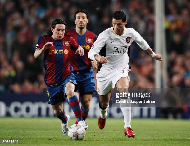 Cristiano Ronaldo of Manchester United holds off the challenge of Lionel Messi of Barcelona during the UEFA Champions League Semi-Final, first leg...