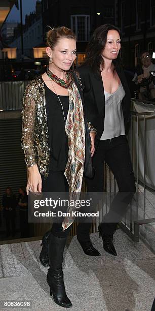 Model Kate Moss and guest leave the Linda McCartney Photographs - Private View at the James Hyman Gallery on April 23, 2008 in London, England.