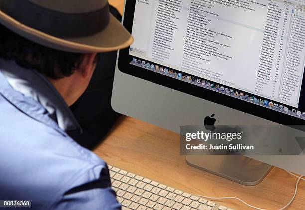 Customer uses an Apple iMac computer at an Apple Store April 23, 2008 in San Francisco, California. Apple reported its second quarter profits today...