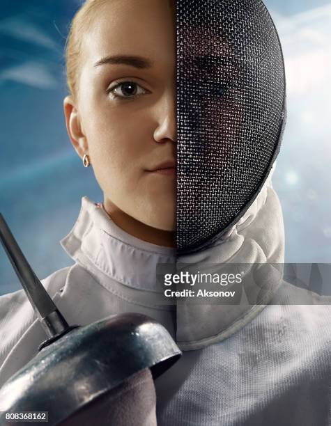 fencer portrait with half face masked - face guard sport stock pictures, royalty-free photos & images