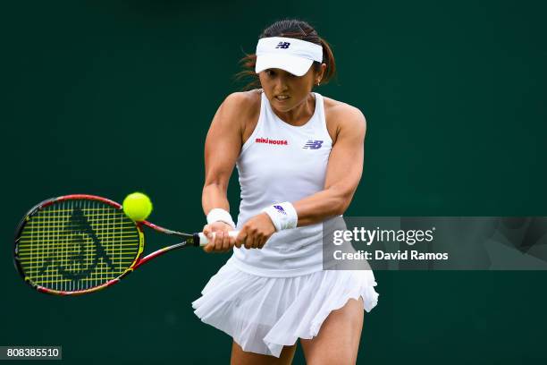 Misaki Doi of Japan plays a backhand during her Ladies Singles first round match against Kristen Flipkins of Belgium on day two of the Wimbledon Lawn...