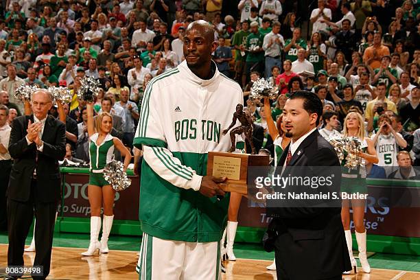 Kevin Garnett of the Boston Celtics accepts his award for NBA defensive player of the year before Game Two of the Eastern Conference Quarterfinals...
