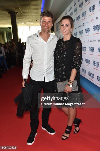 Thomas Mueller and his wife Lisa Mueller during the 'Das Pubertier' Premiere at Mathaeser Filmpalast on July 4, 2017 in Munich, Germany.