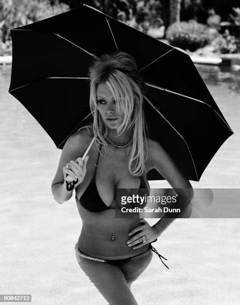 Actress and entrepreneur Jenna Jameson poses for a portrait shoot in Los Angeles for Elle magazine on August 23, 2004.