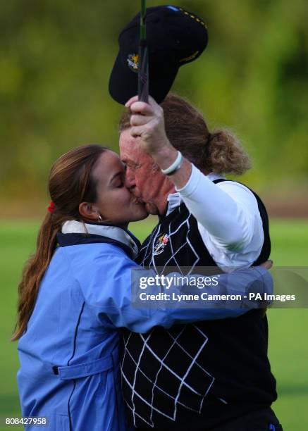 Europe's Miguel Angel Jimenez kisses wife Marian Jimenez on the 18th during the Ryder Cup at Celtic Manor, Newport.