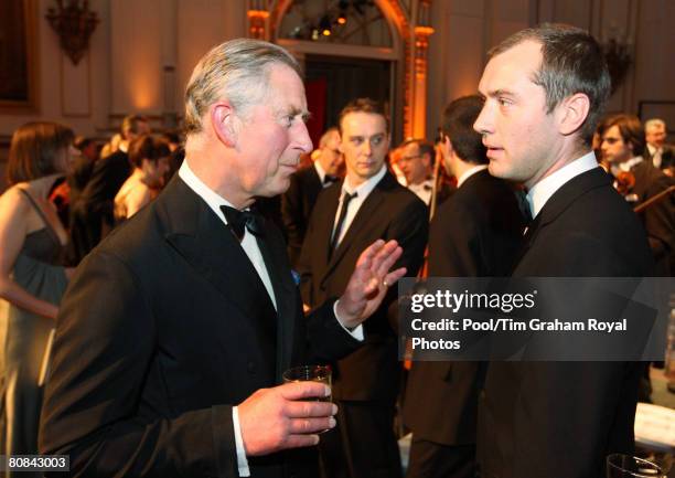 Prince Charles, Prince of Wales chats with actor Jude Law at a gala dinner for supporters of The Prince's Foundation for Children and the Arts at...