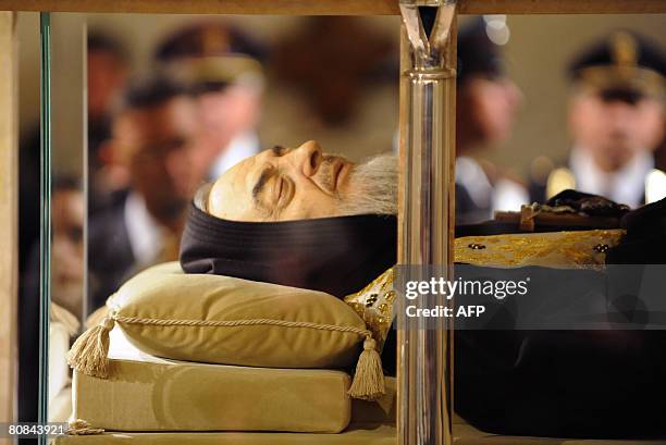 The body of Padre Pio is on display for the veneration of the faithful in a part-glass coffin in the crypt of the old Church of St. Mary of Grace at...