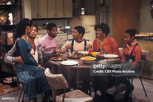 From left, American actors BernNadette Stanis, Ben Powers, Jimmie Walker, Ralph Carter, Ja'net DuBois, and Janet Jackson, as they sit down for a meal...