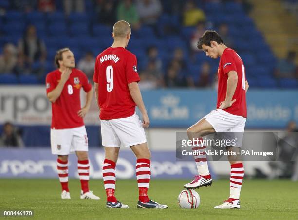Wales' Gareth Bale , Steve Morison and David Vaughan stand dejected after Bulgaria's Ivelin Popov scores the first goal of the game