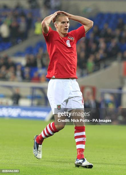 Wales' Steve Morison reacts dejected after missing a shot on goal