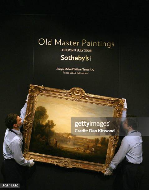 In this photo illustration two Sotheby's employees hold a painting by Joseph Mallord William Turner called Pope's Villa at Twickenham during a...