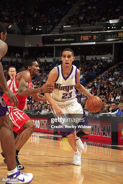 Kevin Martin of the Sacramento Kings dribbles against Luther Head of the Houston Rockets during the game at ARCO Arena on April 1, 2008 in...