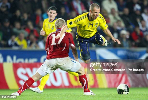 Czech Republic's Tomas Hubschman and Scotland's Kenny Miller battle for the ball during the European Championship Qualifier, Group I match at the...