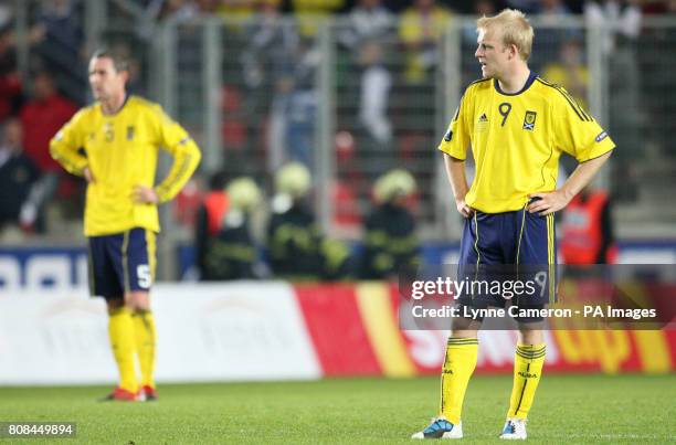 Scotland's Steven Naismith and David Weir stand dejected during the European Championship Qualifier, Group I match at the Synot Tip Arena, Prague.