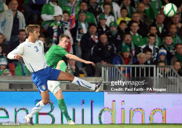 Northern Ireland's Chris Brunt clears the ball past Italy's Domenico Criscito during the European Championship Qualifier, Group C match at the...