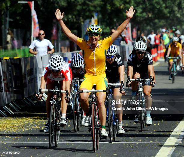 Australia's Rochelle Gilmore celebrates as she crosses the line to win ahead of England's Lizzie Armitstead in second in the 112km Women's Road Race...